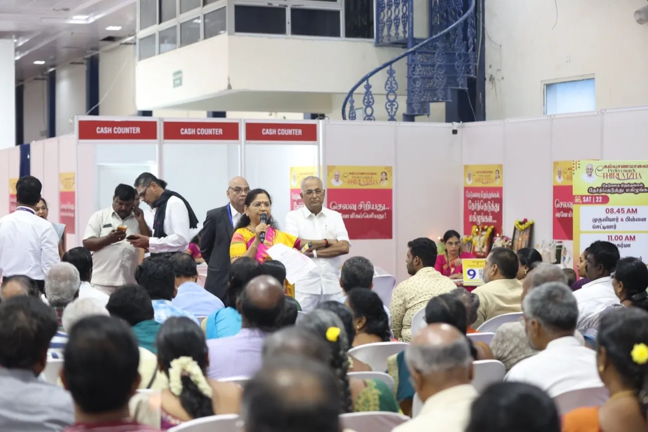 Speaker addressing families at a Kalyanamalai matrimony meet